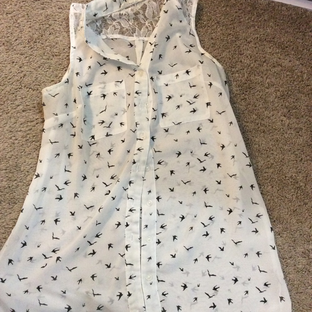 Sleeveless white shirt with black bird design